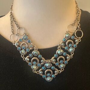 Touchstone Crystal by Swarovski  Rhodium plated necklace with blue crystals.